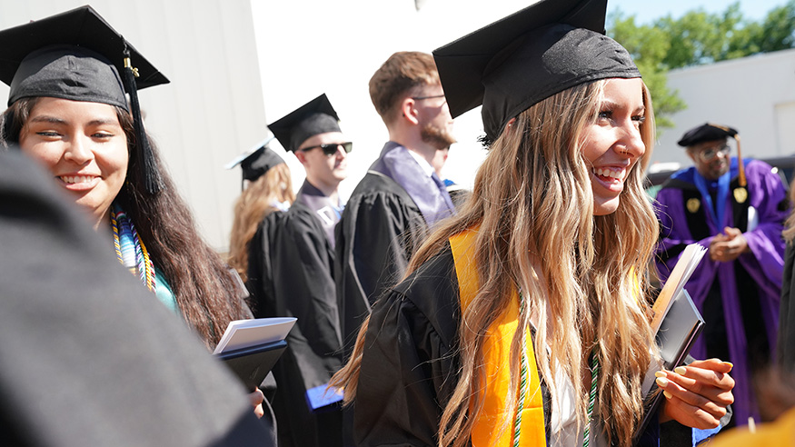 Two students at graduation