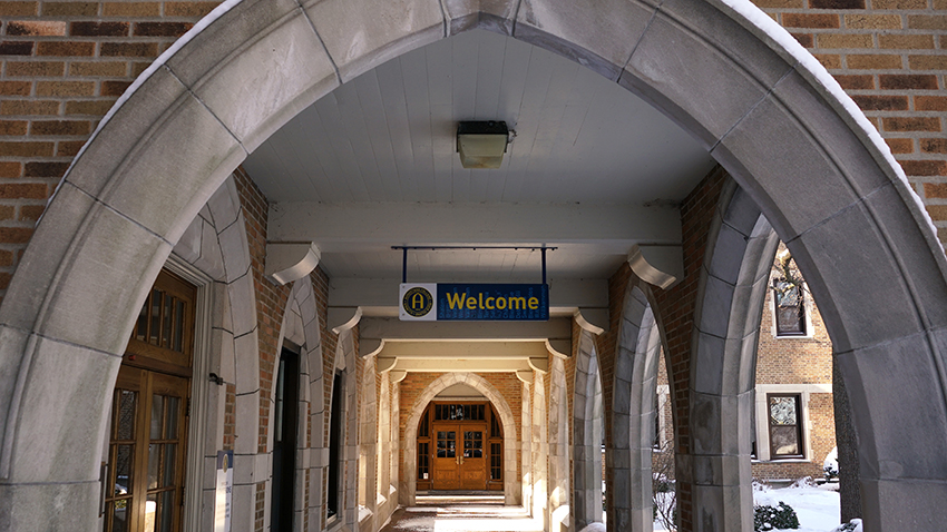 Welcome sign between arches