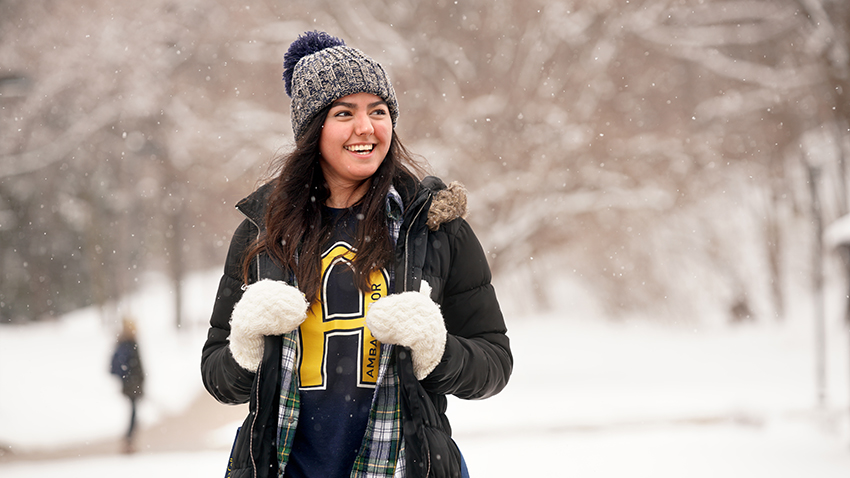 Augie student in the snow