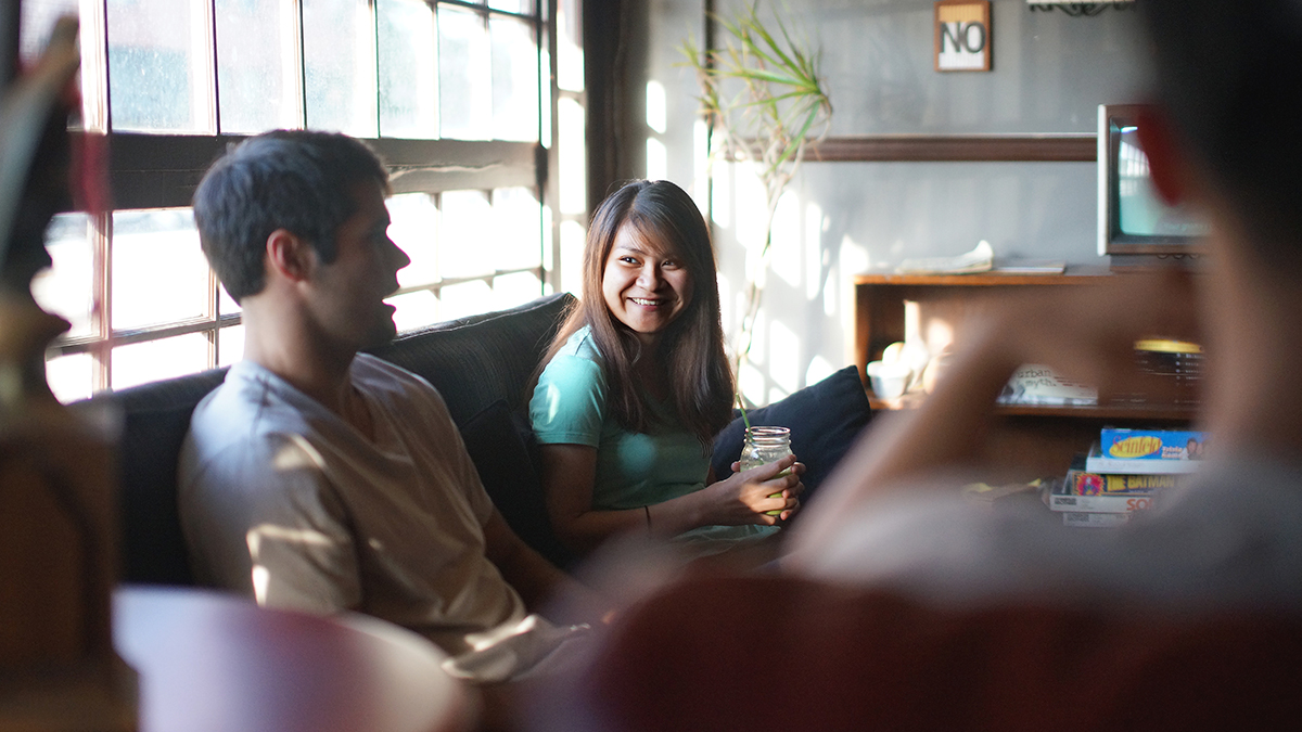 students socialize on a couch