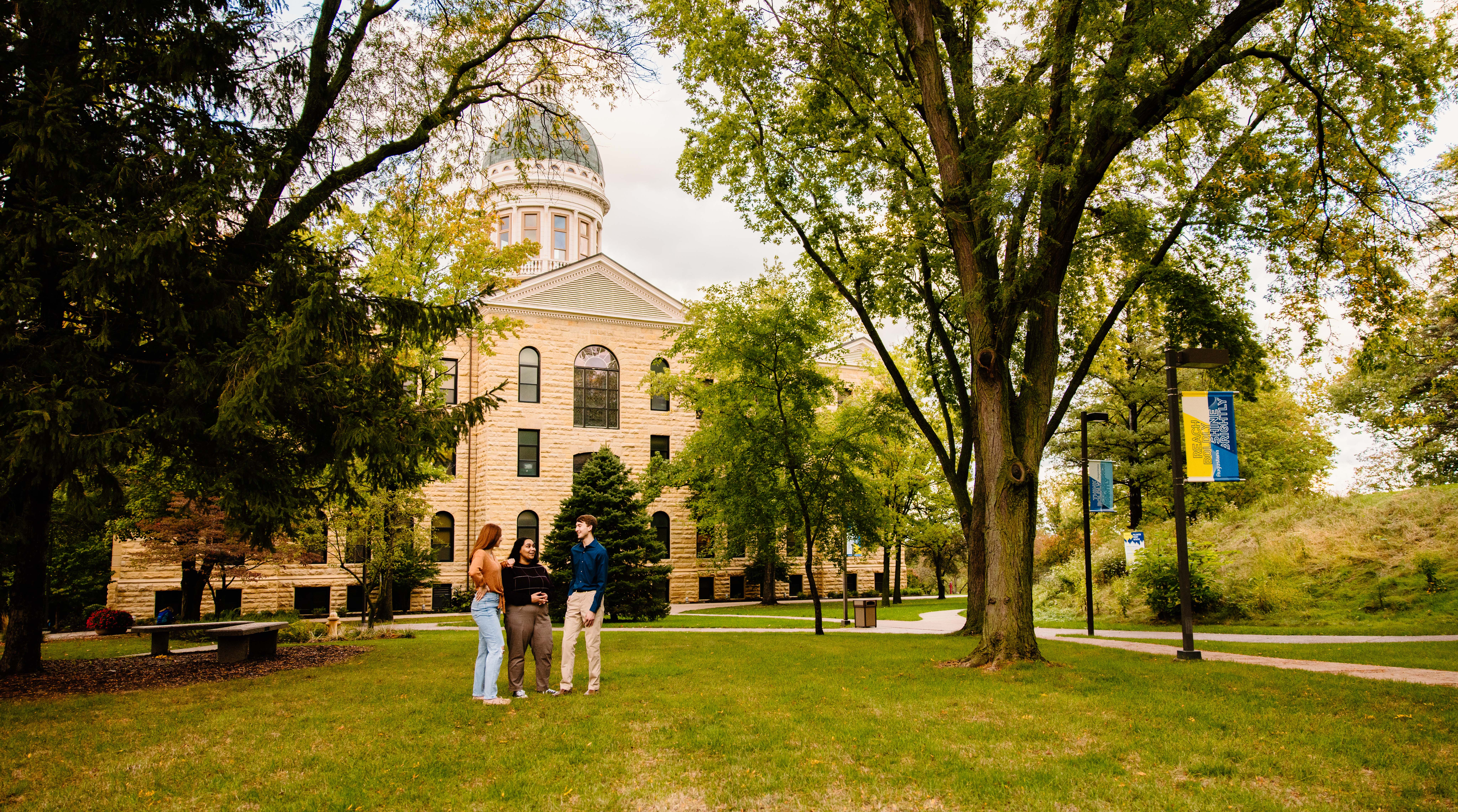 Students in front of Old Main on Augustana's Quad.