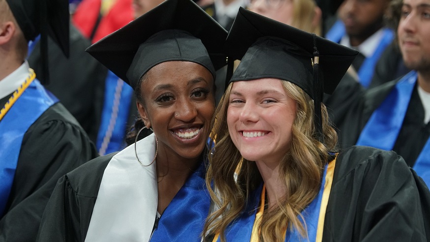 Two students at graduation