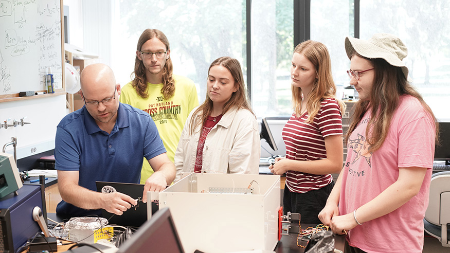 Dr. Nathan Frank with students