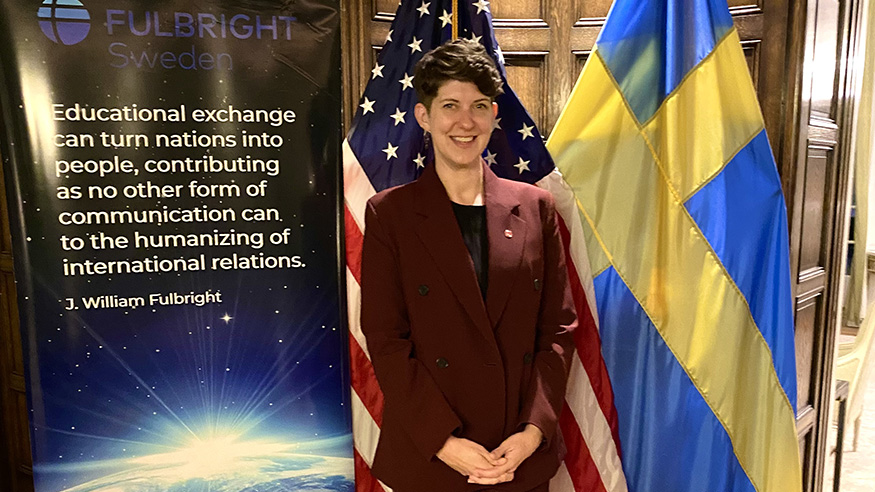 Dr. Lena Hann with American and Swedish flags