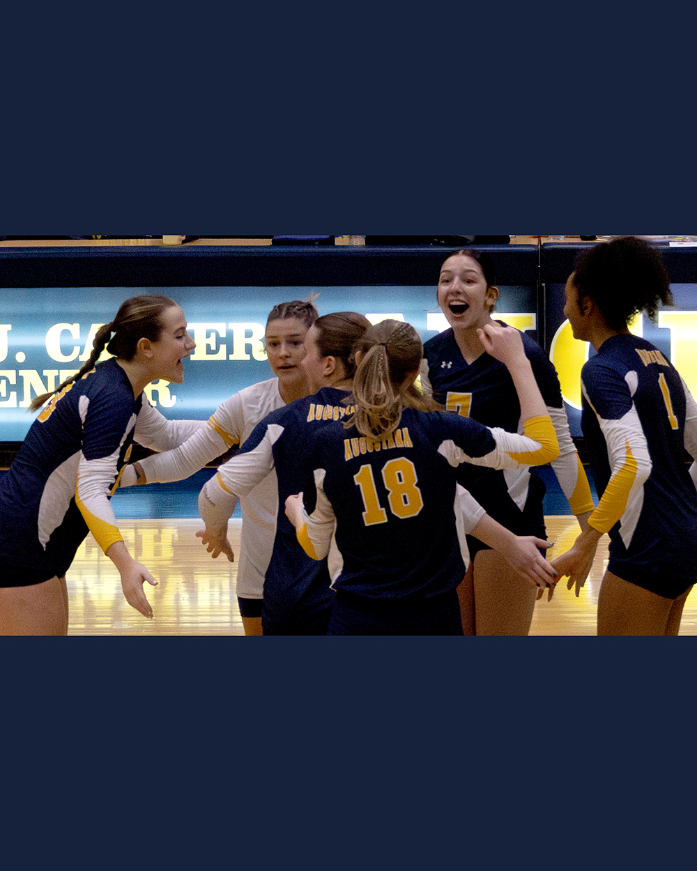 Augustana players celebrate on the court