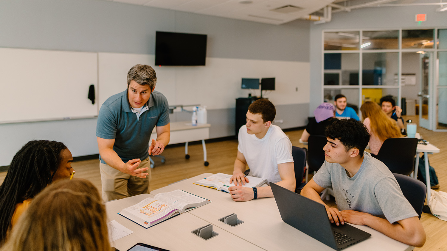 Several students in a STEM class with the professor