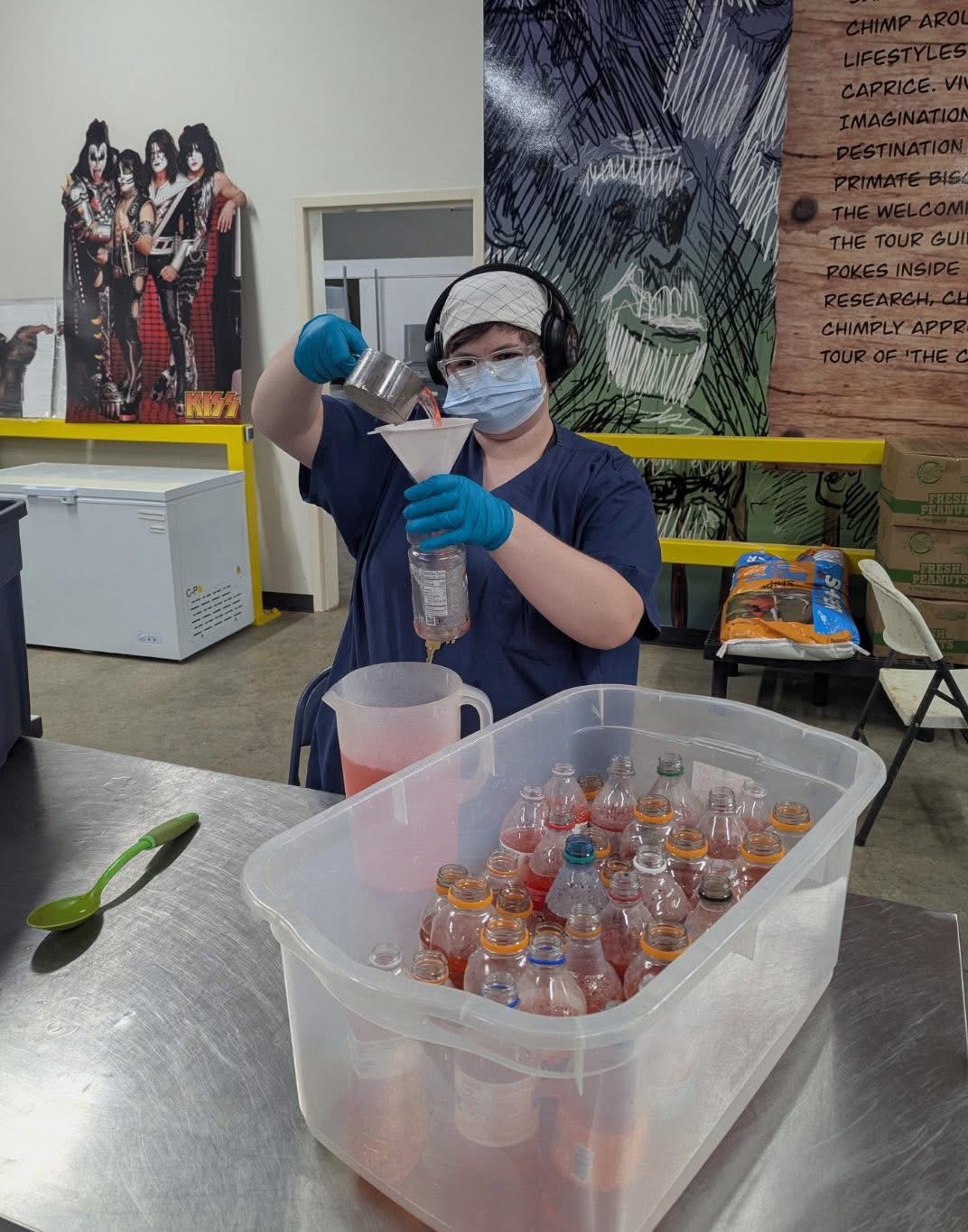 Student making bottle popsicles for the chimps! 