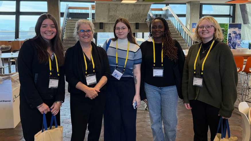 Five students at a conference
