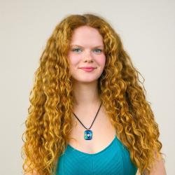 A women posing for a headshot.