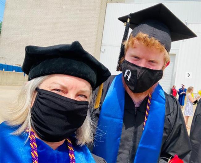 Dr. Kirsten Day and graduate and honoree Shawn Geison at the 2021 Augustana Commencement ceremony. 