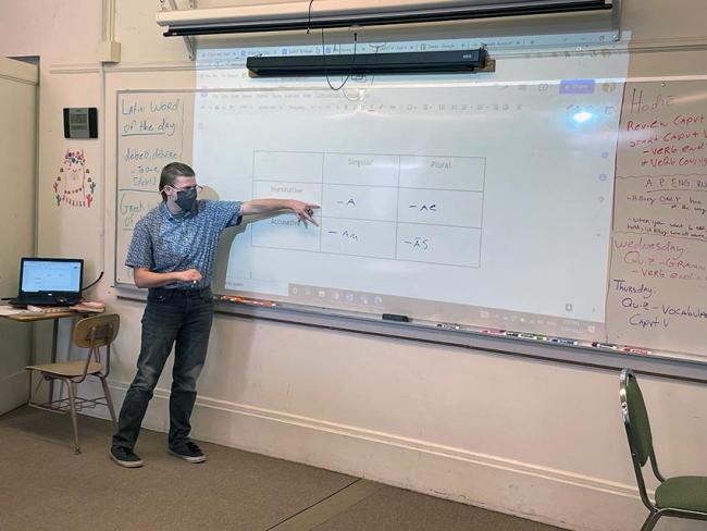 Ezekiel Aurelius offers a Latin grammar lesson to his middle school students at Rivermont Collegiate (Photo credit: Rebecca Rice)