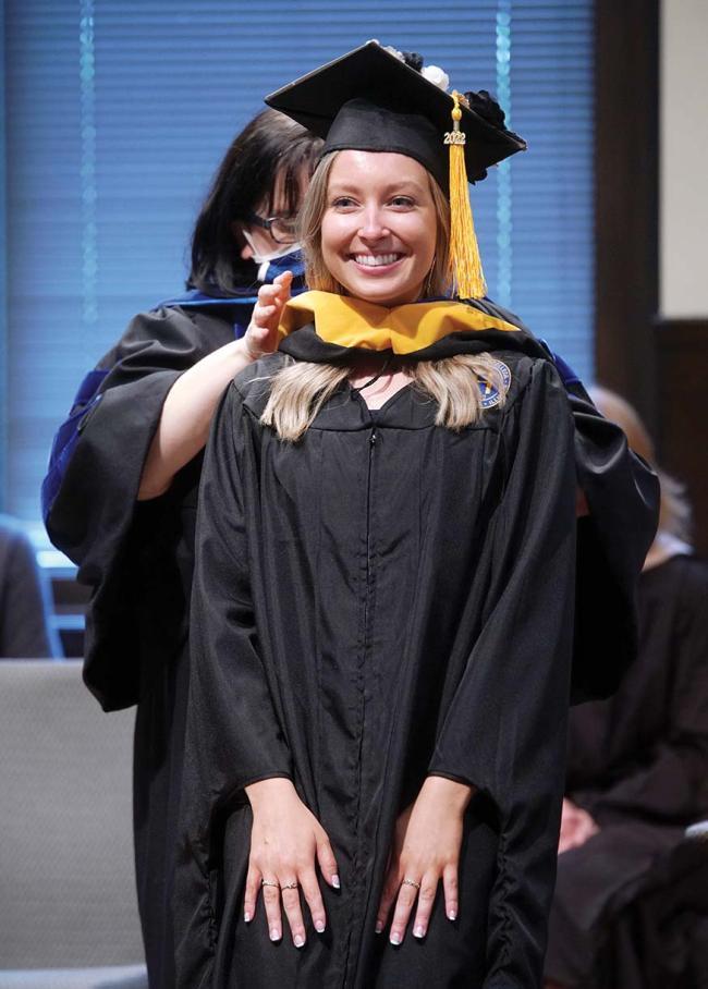 Sara DuBois at hooding ceremony