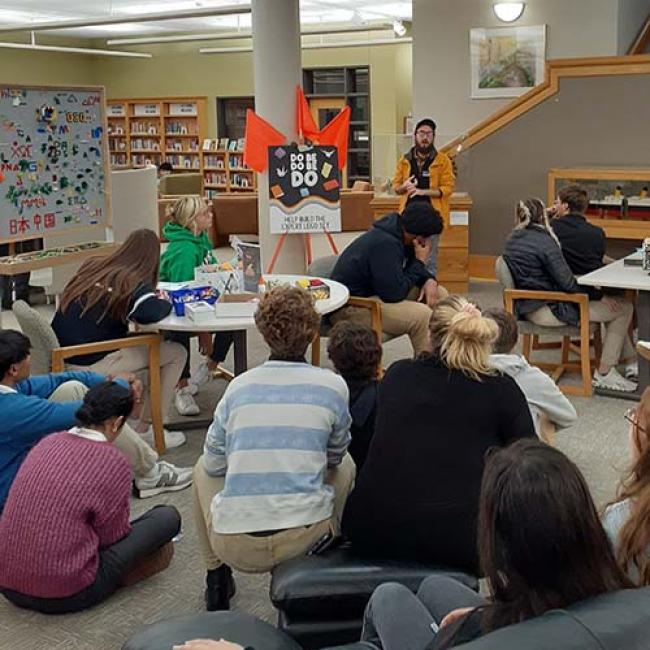  Research and Instruction Librarian Garrett Traylor with high school students.