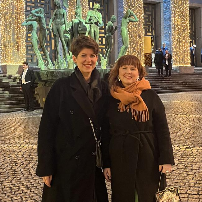 Dr. Lena Hann with Dr. Elina Nilsson stand outside the Stockholm Concert Hall.