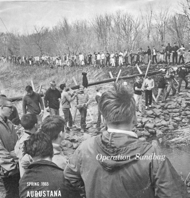 Students positioning sandbags in 1965
